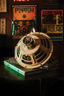 Vintage-style radio on a stand with neon sign in the background